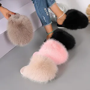 Close-up of colorful fluffy faux fur slippers showing soft texture and indoor warmth.