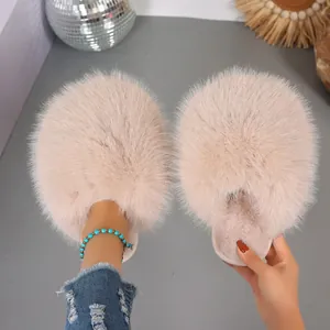Close-up detail of fluffy faux fur winter slippers showing soft plush texture and cozy design