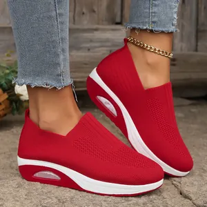 Detailed view of red fly-woven rocker shoes with visible air cushion sole