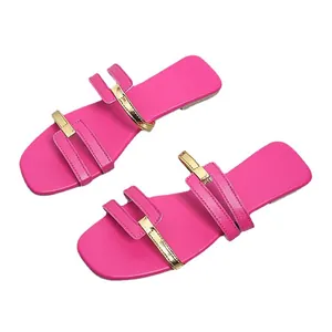 Stylish hot pink flat sandals for women featuring elegant gold metallic strap accents
