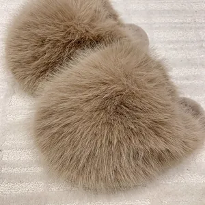Close-up detail of soft fluffy faux fur on warm winter home slippers