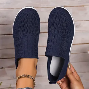 Top view of navy blue woven slip-on shoes showing the textured breathable mesh material