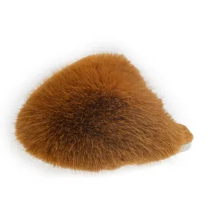 Close-up of brown fluffy faux fur slipper showing soft texture and cozy winter design