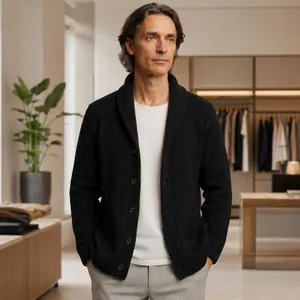 Detailed shot of a men's black shawl collar knitted cardigan worn by a model in a store