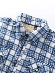 Close-up detail of blue and white plaid flannel shirt with warm sherpa fleece lining
