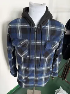 Close-up detail of a men's blue and black plaid hooded fleece jacket on a mannequin
