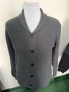 Detailed view of men's grey ribbed knit cardigan featuring a shawl collar and dark buttons.