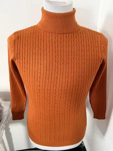 Close-up of men's slim fit orange turtleneck sweater with detailed cable knit pattern