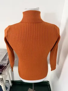 Detail view of men's orange slim fit ribbed knit turtleneck sweater on mannequin back.