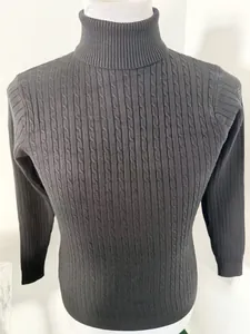 Detail view of men's black slim fit turtleneck sweater with cable knit texture