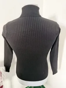 Rear view of a black ribbed knit turtleneck sweater for men with slim fit design