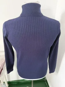 Detailed rear view of a navy blue slim-fit ribbed knit turtleneck sweater for men