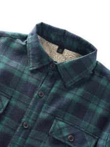 Close-up of green plaid flannel shirt showing warm fleece lining and buttons