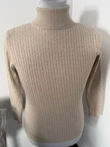 Detailed view of the cable-knit texture on this men's slim-fit turtleneck sweater