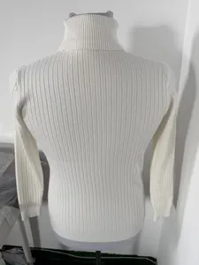 Detail of a white slim-fit ribbed turtleneck sweater for men displayed on a torso mannequin