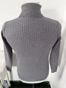 Macro detail showing the ribbed texture of a gray men's slim fit turtleneck knit sweater