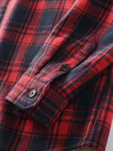 Detailed close-up showing the sleeve cuff and thick red plaid fabric of this men's flannel shirt
