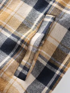 Macro detail of high-quality plaid fabric texture on men's thick winter flannel shirt