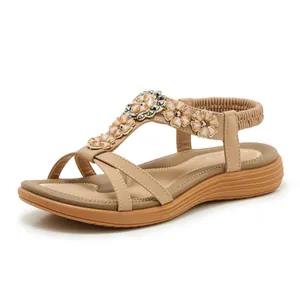 Side view of Bohemian T-strap sandals with floral rhinestone decor and elastic back