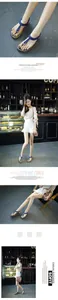 Elegant blue T-strap flat sandals with metallic buckle and elastic back strap in a cafe