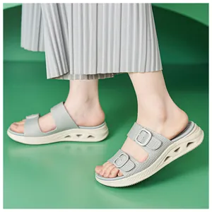 Detail of breathable hollow wedge sandals with buckle straps for women