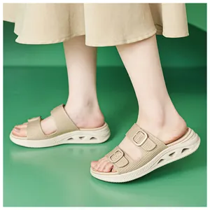Detail view of breathable women's hollow platform sandals with adjustable straps in khaki.