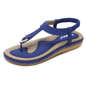 Royal blue women's beach sandals with elastic back strap and metallic T-strap detail