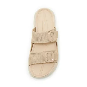 Top view detail of beige platform slides with breathable knit straps and buckles.