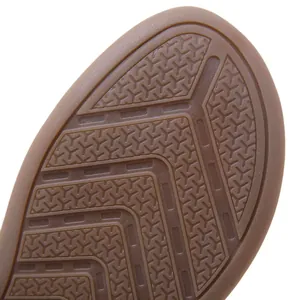 Detailed macro view of the non-slip rubber outsole texture on comfortable wedge sandals