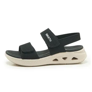 Vista laterale di sandali sportivi da donna neri in fly-knit con suola beige platform