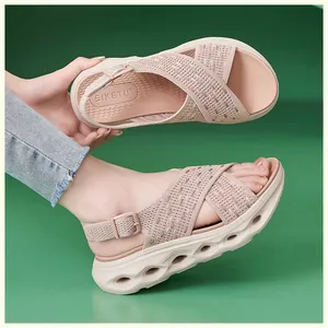 Comfortable pink fly-knit platform sandals with adjustable heel strap