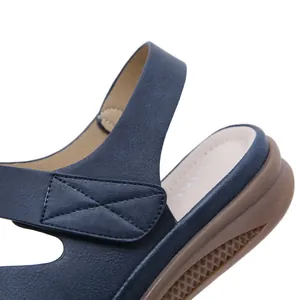 Close-up detail of blue retro wedge sandal showing material texture and stitching