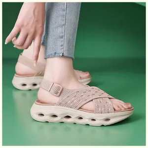 Side view of women's beige platform sandals featuring breathable fly-knit cross straps