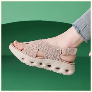 Close-up of pink fly-woven platform sandal with hollow-out sole design