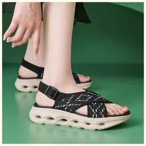 Detail of women's thick-soled flyknit sandals with a comfortable hollowed-out wedge sole.