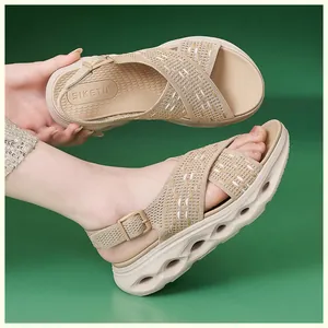 Detailed view of beige fly-knit platform sandals with a comfortable and hollowed-out sole design