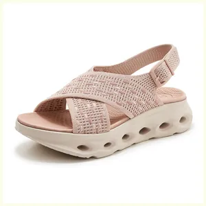 Pink fly-knit platform sandals with breathable hollow sole and adjustable heel strap.
