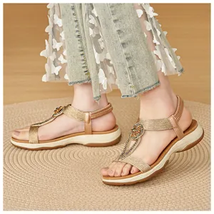 Detailed macro shot of women's bohemian rhinestone sandals with soft soles on a woven mat
