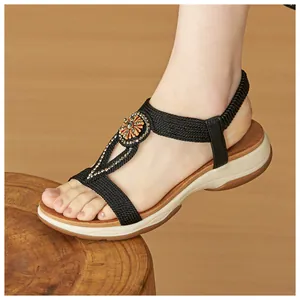 Stylish bohemian black sandals with rhinestone flower detail on a soft anti-slip platform sole