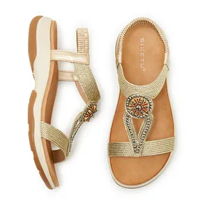 Close-up of gold Bohemian rhinestone sandals with comfortable soft non-slip soles