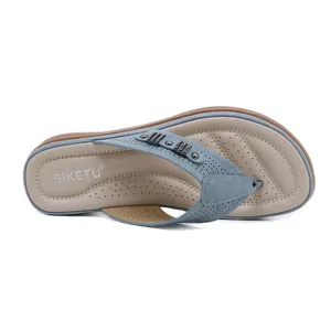 Retro blue women's wedge flip-flop sandals with comfortable padded insole and metal accents