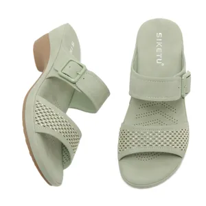 Women's sage green wedge sandals with rhinestones and buckle detail for summer beach.
