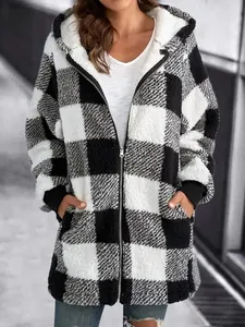 Detailed view of a cozy black and white checkered plush hooded jacket with zipper and pockets