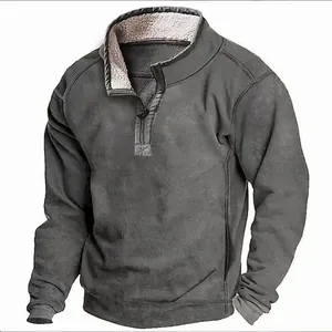 Detailed view of men's grey quarter-zip sweatshirt with warm fleece-lined mock neck collar