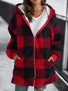Detail of a cozy red and black buffalo plaid fleece hooded jacket with soft white lining.