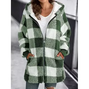 Detailed view showing the soft texture of a green plaid hooded plush jacket for women
