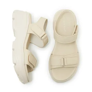 Top-down view of beige platform sandals with adjustable velcro straps and Siketu logo.