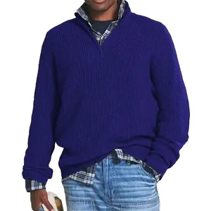 Detail view of a men's royal blue quarter-zip knitted sweater for winter