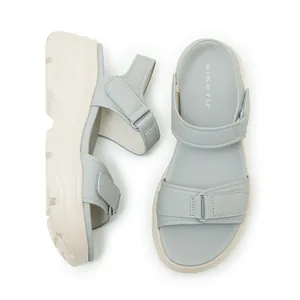 Top view detail of women's light blue platform sandals with velcro straps