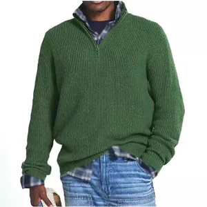 Classic green men's quarter-zip ribbed knit sweater worn over a stylish blue plaid shirt